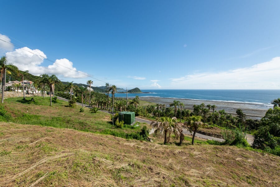 Elevated plot with a broad coastal outlook